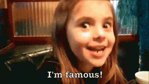 little girl saying, 'i'm famous!'